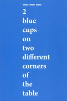2 blue cups on two different corners of the table 